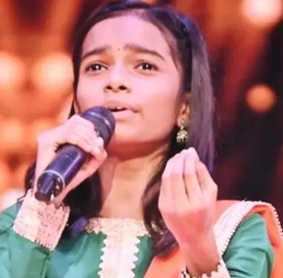 अ