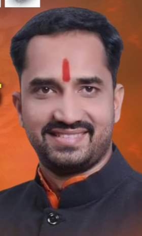 इ