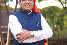अ