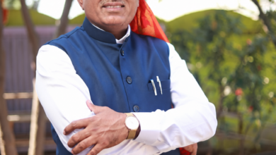 अ