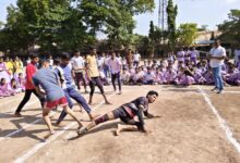अ